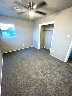 Abilene house for rent - an empty room with carpet and a ceiling fan