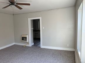 Abilene apartment for rent - A room with a ceiling fan and a window.