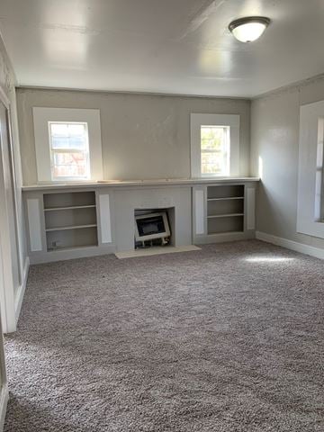 Abilene apartment for rent - A room with a fireplace and built-in shelves.