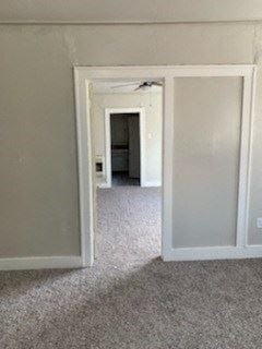 Abilene apartment for rent - A room with a carpeted floor and a white door.