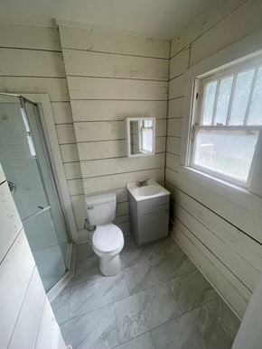 Abilene apartment for rent - A bathroom with a toilet and a toilet paper holder.
