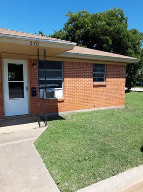Abilene apartment for rent - the front of a brick house with a white door