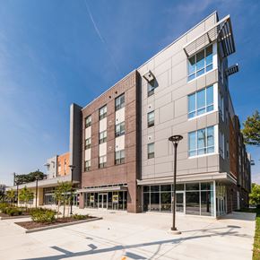 Cincinnati apartment for rent - a large building with a sidewalk in front of it