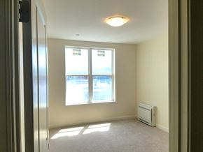 Melrose apartment for rent - an empty room with a window and a radiator