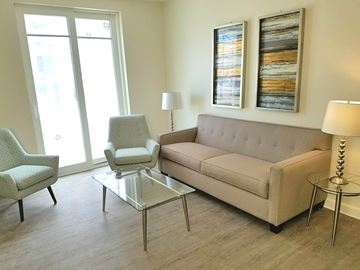 Melrose apartment for rent - a living room with a couch and two chairs