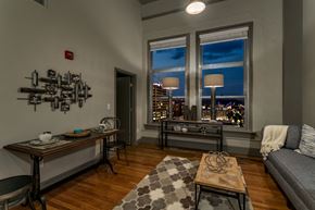Chattanooga apartment for rent - the living room of an apartment with a view of the city at night