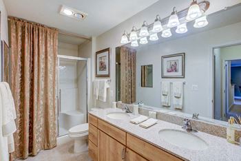 Granite counter tops with full vanity-width mirrors 