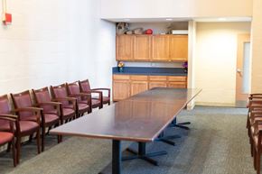 Annapolis apartment for rent - a conference room with a long wooden table and chairs
