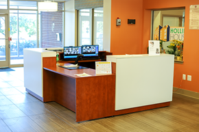 Baltimore apartment for rent - a reception desk with two monitors on top of it