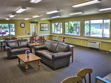 Weiser apartment for rent - a living room with leather couches and tables