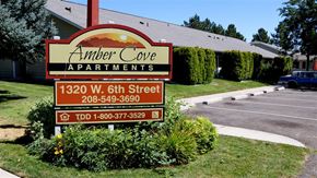Weiser apartment for rent - a sign apartments in front of a parking lot