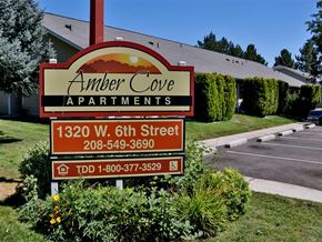 Weiser apartment for rent - a sign apartments in front of a parking lot