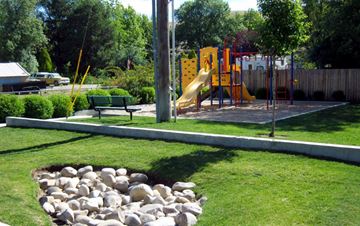 Boise apartment for rent - a playground with a slide and a pile of rocks