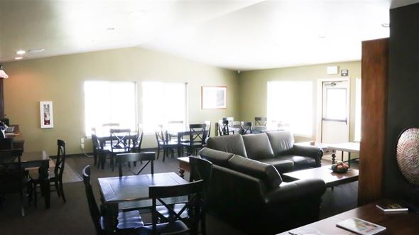 Filer apartment for rent - a living room and dining room with couches and tables