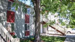 Filer apartment for rent - an apartment building with a tree in front of it