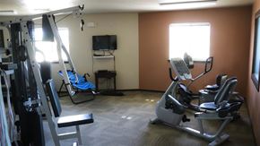 Idaho Falls apartment for rent - a gym with exercise equipment and a tv