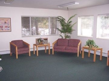 Boise apartment for rent - a living room with couches and chairs and a plant