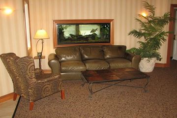 Nampa apartment for rent - a living room with a leather couch and a table