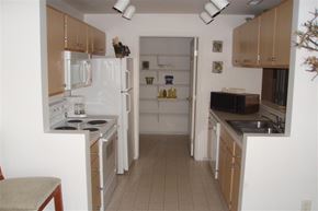 Nampa apartment for rent - a small kitchen with a stove and a refrigerator