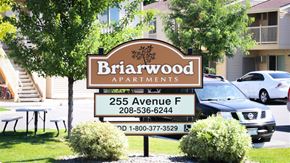 Wendell apartment for rent - a sign for birwood apartments in front of a parking lot