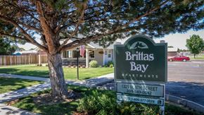 Weiser apartment for rent - a sign for britas bay apartments in front of a tree