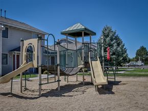 Weiser apartment for rent - a playground with a slide and climbing equipment in front of a house