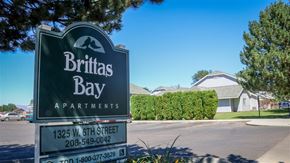 Weiser apartment for rent - a sign for britas bay apartments in front of a street