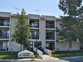 Rupert apartment for rent - an apartment building with a street sign in front of it