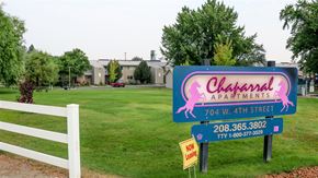 Emmett apartment for rent - a sign that is in front of a grass field