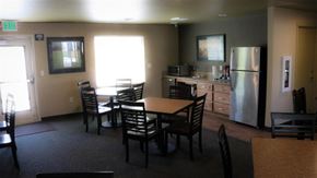 Twin Falls apartment for rent - a kitchen and dining room with a table and chairs and a refrigerator