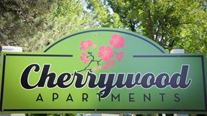 Twin Falls apartment for rent - a sign for chewywood apartments in front of trees