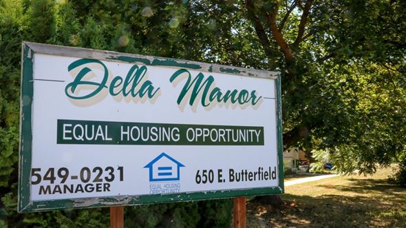 Weiser apartment for rent - a sign opportunity manager in front of trees