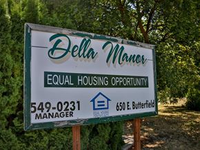 Weiser apartment for rent - a sign manera equal housing opportunity manager in front of trees