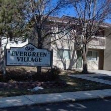 Gooding apartment for rent - the evergreen village sign in front of a house