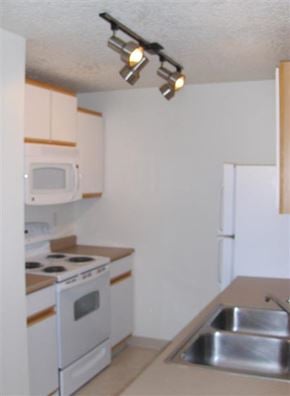 Nampa apartment for rent - an empty kitchen with a sink and a stove