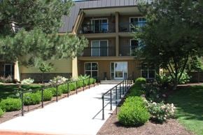 Gooding apartment for rent - the front of an apartment building with a walkway and stairs