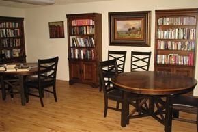 Gooding apartment for rent - a dining room with a table and chairs and a library