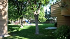 American Falls apartment for rent - a backyard with a playground and trees