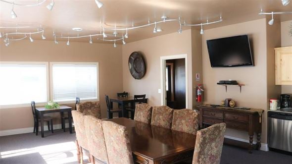 American Falls apartment for rent - a living room with a dining room table and a television