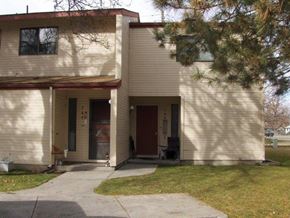 Boise apartment for rent - a white house with a sidewalk in front of it