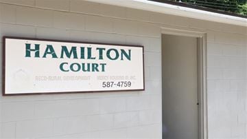 Mountain Home apartment for rent - a sign court on the side of a building