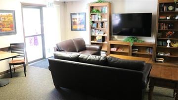 Ontario apartment for rent - a living room with a leather couch and a television