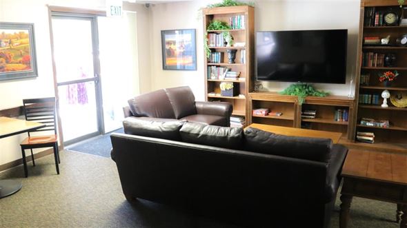 Ontario apartment for rent - a living room with a leather couch and a television