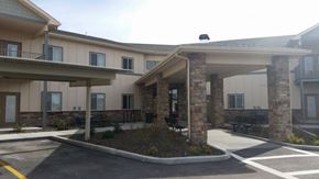 Lewiston apartment for rent - a building with two pillars and a parking lot