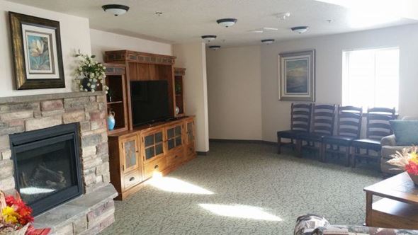 Lewiston apartment for rent - a living room with a fireplace and chairs