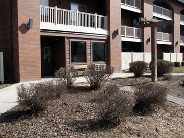 Caldwell apartment for rent - a sidewalk in front of a brick building