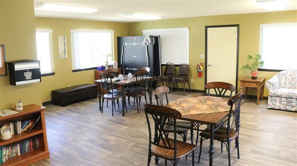 Payette apartment for rent - a living room with tables and chairs and a television