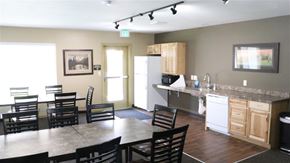 Rexburg apartment for rent - a kitchen and dining room with a table and chairs