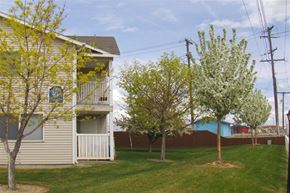 Caldwell apartment for rent - a white house with trees in front of it
