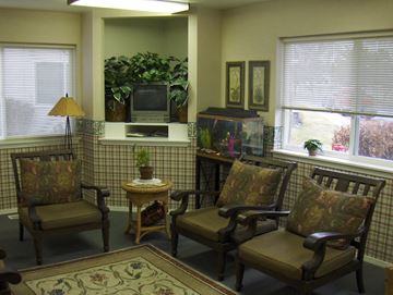Nampa apartment for rent - a living room with chairs and a television